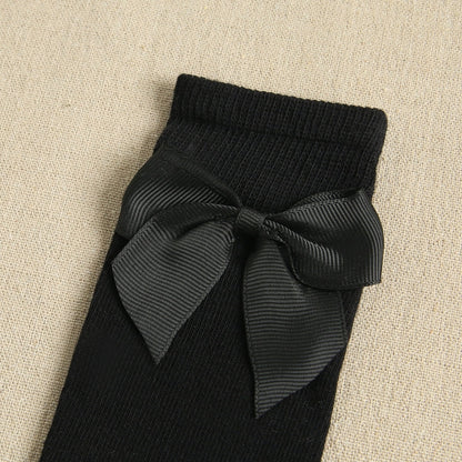 Calcetines altos liso con lazo color negro